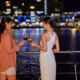 Ladies having a drink on the deck of Spirit of Cairns at nighttime